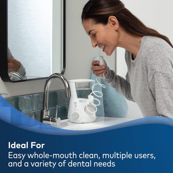 A close-up image of the Waterpik Aquarius Water Flosser, showcasing its sleek design and adjustable water pressure settings. The device is positioned on a countertop with its water reservoir visible, emphasizing its convenience and effectiveness for oral hygiene."