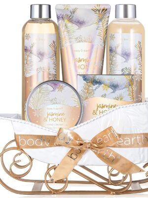 An elegant gift basket adorned with a ribbon, containing a variety of bath and body products including bubble bath, hand cream, shower gel, body lotion, and bath salts. The products feature a delightful jasmine and honey scent, promising a luxurious sensory experience for the recipient.