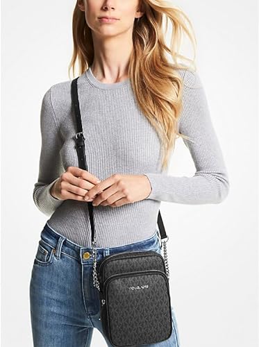 The image depicts the Michael Kors Jet Set Travel Medium Logo Crossbody Bag in black. It is a chic and practical accessory suitable for everyday use.