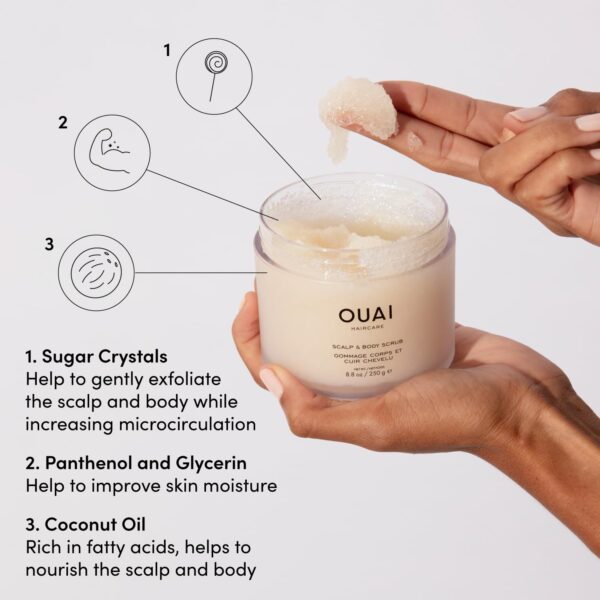 A white bottle of OUAI Scalp & Body Scrub against a soft, pastel background. Text reads "OUAI Scalp & Body Scrub - Foaming Coconut Oil Sugar Scrub and Gentle Scalp Exfoliator Cleanses, Removes Buildup, and Moisturizes Dry Skin - Paraben, Phthalate and Sulfate Free Body Care (8.8oz)." The bottle is surrounded by coconut halves and sugar crystals, evoking the natural ingredients used in the product.
