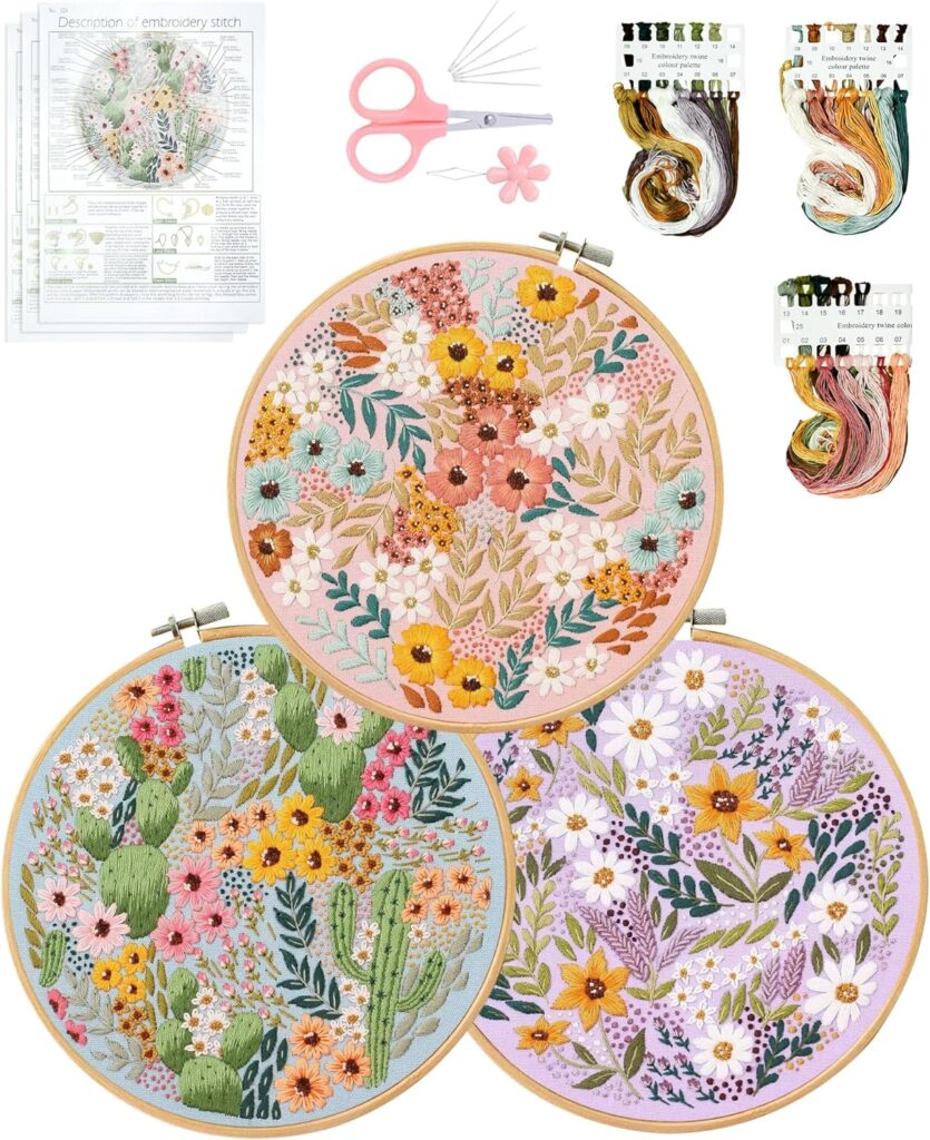 An embroidery kit designed for beginners and adults, featuring three sets of cross-stitch materials. The kit includes fabric with pre-printed flower patterns, embroidery hoops, needles, and colored threads. The fabric is stamped with easy-to-follow designs, allowing crafters to create intricate embroidery projects. The set comes with everything needed for handcrafting, making it suitable for those who are new to embroidery or looking to explore needlepoint. The embroidery hoops and other materials are neatly packaged, offering a complete crafting experience in one box.