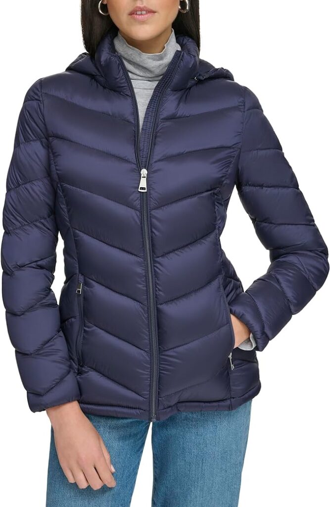 "Women's lightweight hooded puffer jacket by Calvin Klein." 😊