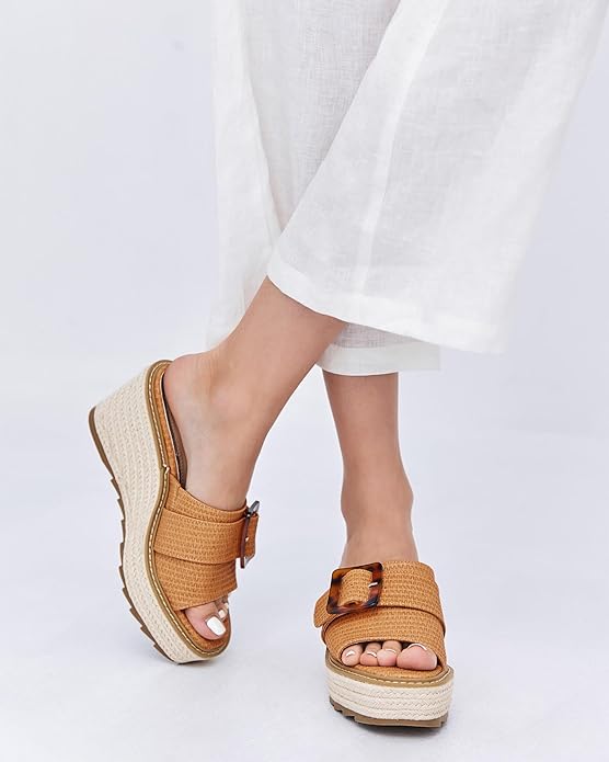 “Step into style and comfort with Coutgo Women’s Wedge Sandals. These open toe platform espadrille heels are the perfect addition to your summer shoe collection. The slip-on design with a buckle closure ensures a secure fit, while the casual yet chic style makes them versatile for any occasion.” You can find these sandals on Amazon1