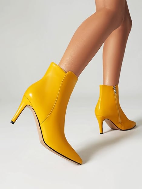 “Stylish pointed-toe ankle boots with a high stiletto heel. These yellow booties feature a sleek design, perfect for adding a pop of color to your outfit. The pointed toe adds a touch of sophistication, making them suitable for both casual and dressy occasions.” You can find these boots on Rage SA1. 👢🌟