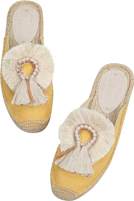 “Stylish canvas mule shoes with red tassel and fluffy ball embellishments. These espadrilles feature a breathable linen fabric upper, soft jute rope insole, and an anti-slip rubber outsole. Perfect for casual wear, vacations, and outdoor activities.” You can find these mule shoes on Amazon1.