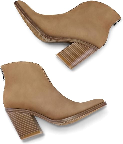 “Stylish ankle boots with a unique V-cut design. These pointed-toe booties feature a 3.4-inch chunky stacked heel, creating an elevated appearance that seamlessly blends sophistication and comfort. The convenient back zip closure ensures easy on-and-off, while the soft cotton lining provides a snug and breathable interior. Suitable for various occasions, from casual jeans to graceful dresses.” You can find these booties on Amazon1