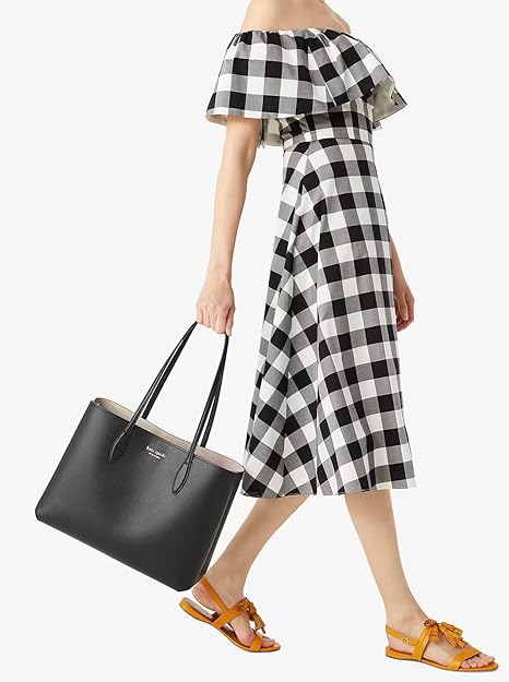 Chic and spacious, the Kate Spade New York All Day Large Tote in classic black is a must-have. Crafted from high-quality materials, this tote features a roomy interior, sturdy handles, and subtle branding. Perfect for work, travel, or a day out—it’s your stylish companion from morning to night!”