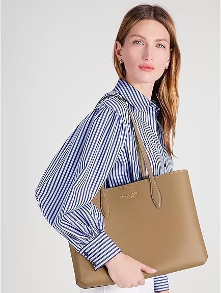 “Chic and spacious, the Kate Spade New York All Day Large Tote combines timeless elegance with everyday functionality. Crafted from high-quality materials, this tote features ample room for all your essentials. Perfect for work, travel, or a day out!”