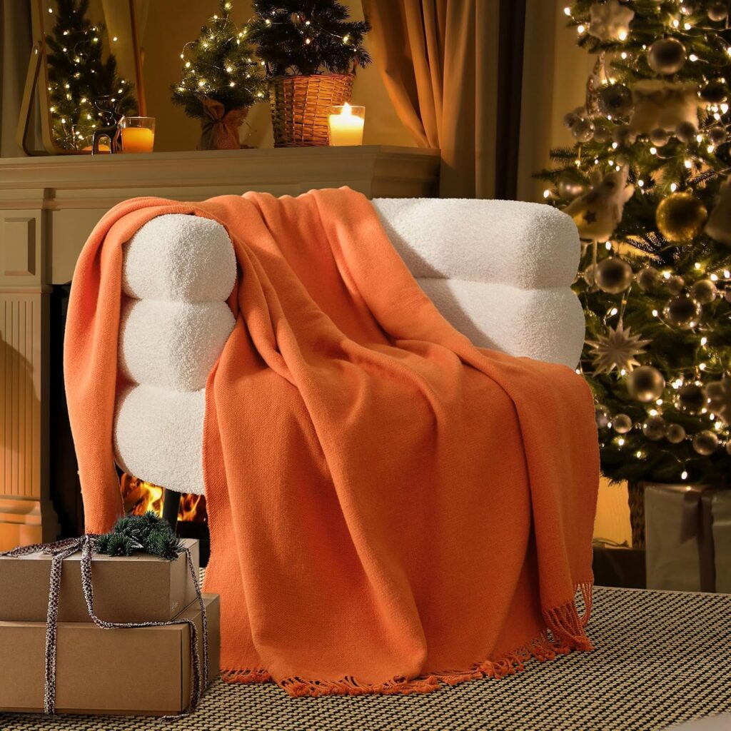 A luxurious and soft Alpaca wool throw blanket by Bedsure, featuring a double-stitch design. This warm and cozy fleece blanket has a fall plaid pattern, making it perfect for adding a touch of elegance to any couch or living space. Ideal for both decorative and practical use."