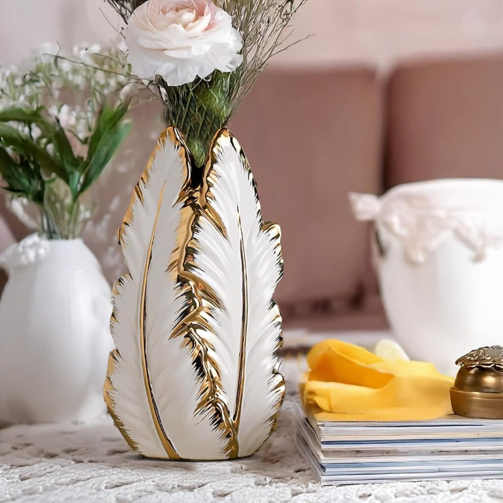 Elegant high-end vases featuring a Nordic light luxury design with gold-painted accents. These ceramic vases have a refined and sophisticated appearance, perfect for adding a touch of opulence to any space. Ideal for displaying fresh flowers or as standalone decorative pieces."