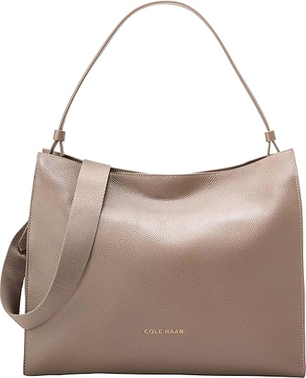 Cole Haan Carryall Satchel – Elegant and Versatile Handbag for Women – A sophisticated satchel with a structured silhouette, crafted from premium leather. Designed for both style and functionality, this carryall features dual top handles and a detachable shoulder strap for versatile carrying options. The spacious interior offers ample room for daily essentials, while sleek hardware accents add a refined touch.