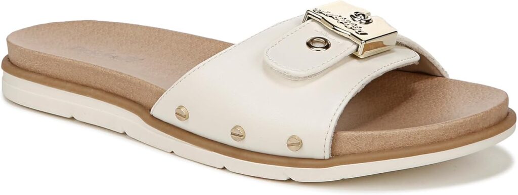 "Dr. Scholl's Women's Nice Iconic Flat Sandal in white, featuring a minimalist design with a comfortable footbed and sleek adjustable strap for effortless summer style."